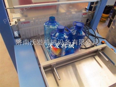 烟台玻璃水PE膜塑包机，饮料牛奶PE膜热收缩包装机%青岛啤酒收缩机